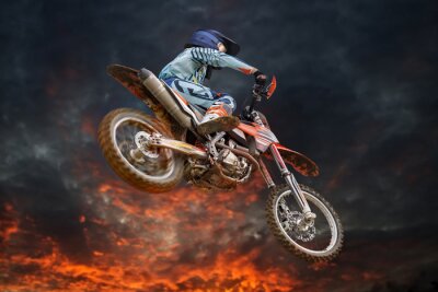 Fotobehang Vliegende motorcrosser brand storm