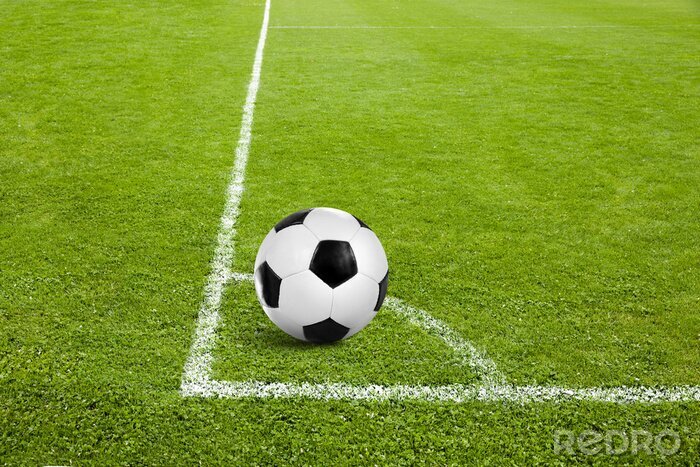 Fotobehang Voetbal in de hoek van het voetbalveld