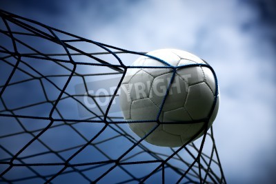 Fotobehang Voetbal in het net tijdens de nachts