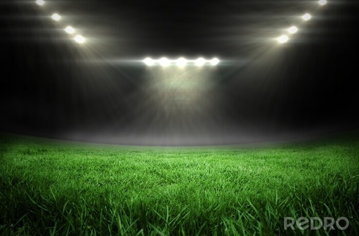 Fotobehang Voetbalveld met fel licht