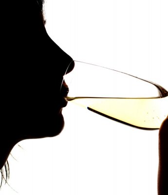 Fotobehang Vrouw met een glas wijn