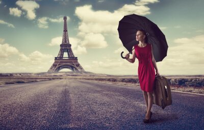 Fotobehang Vrouw met een koffer in Parijs