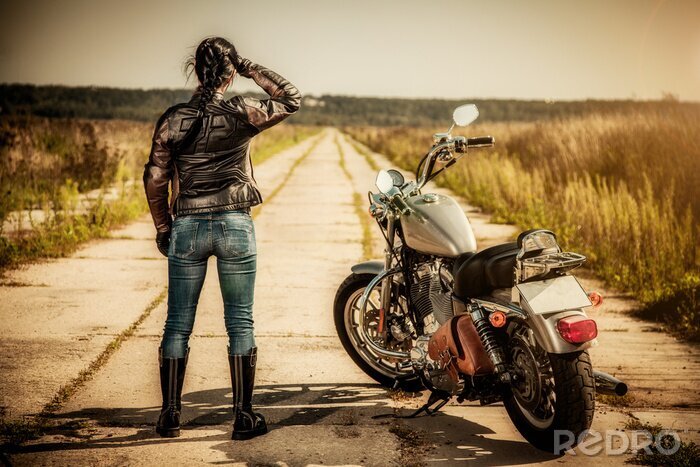Fotobehang Vrouw met een motor