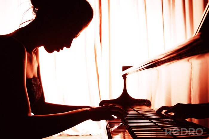 Fotobehang vrouw speelt piano