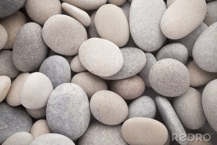 Fotobehang Watergewassen stenen in gedempte kleuren