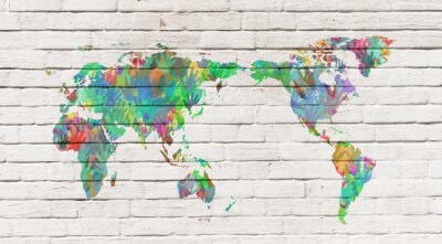 Wereldkaart met handafdrukken op bakstenen achtergrond