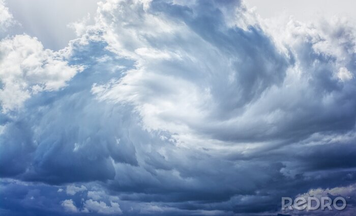 Fotobehang Werveling van golvende wolken