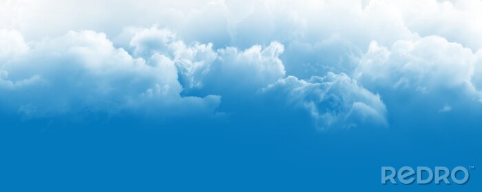 Fotobehang Witte wolken in de blauwe lucht