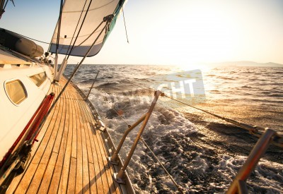 Fotobehang Zeilboot bij ondergaande zon