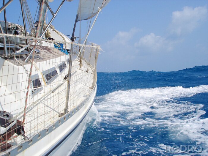 Fotobehang Zeilboot en golven