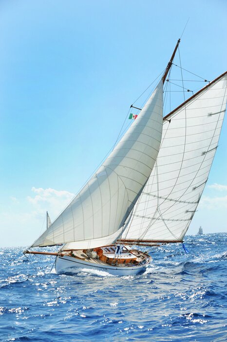 Fotobehang Zeilboot op een bruisende oceaan