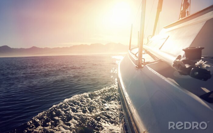 Fotobehang Zeilboot zee en zon