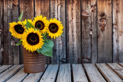 Fotobehang Zonnebloemen op een houten achtergrond