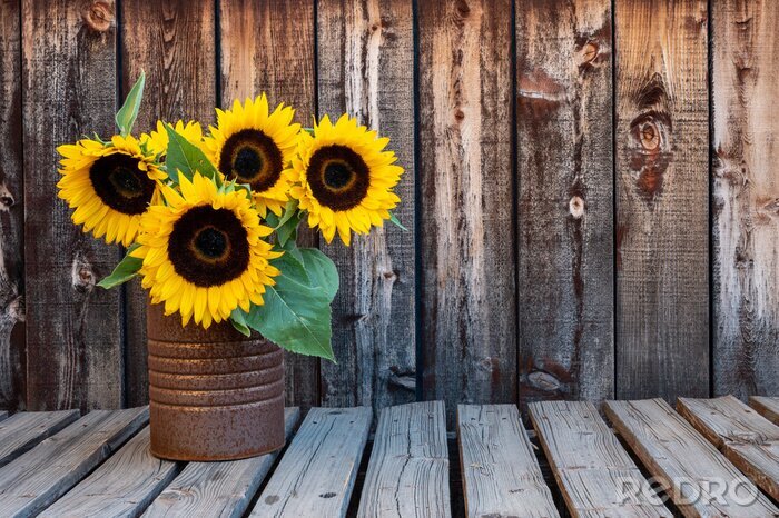 Fotobehang Zonnebloemen op een houten achtergrond