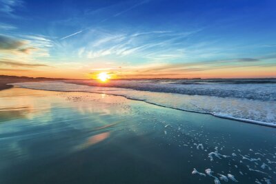 Fotobehang Zonsondergang achter de zee