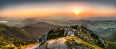 Fotobehang Zonsondergang vanaf de top van een berg