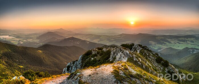 Fotobehang Zonsondergang vanaf de top van een berg