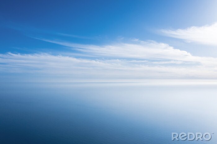 Poster An aerial view of eternal blue sea or ocean with sunny and cloudy sky.