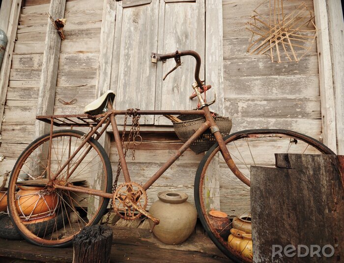Poster Antieke fiets op een houten veranda
