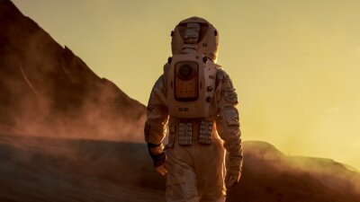 Fotobehang Astronaut op Mars tijdens zonsondergang