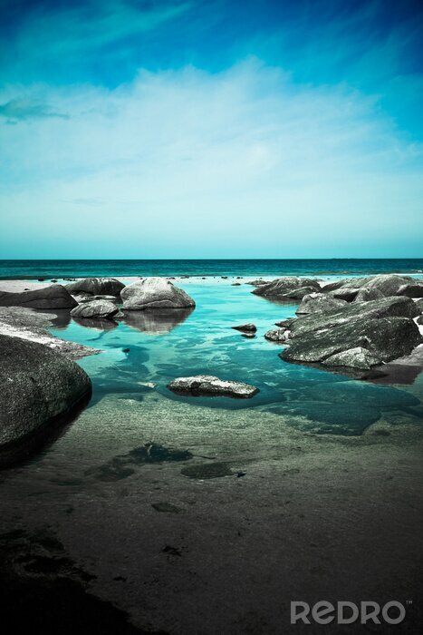 Poster Azuurblauwe oceaan en rotsen