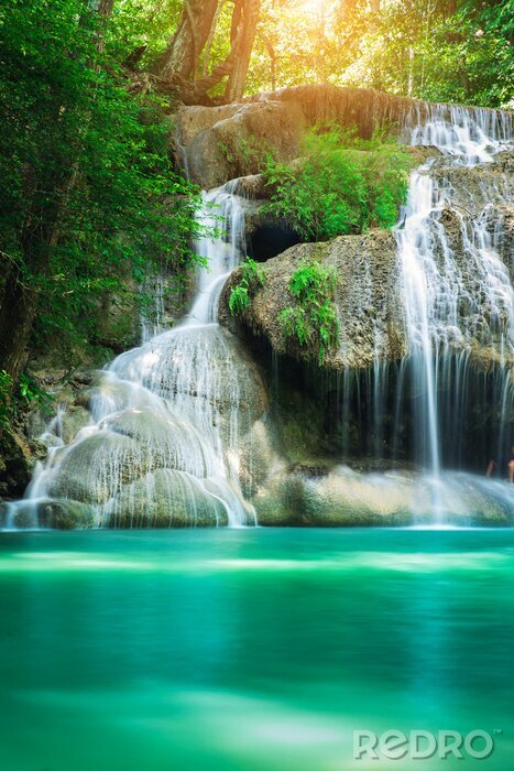 Poster Beauty in nature, amazing Erawan waterfall in tropical forest of national park, Thailand  