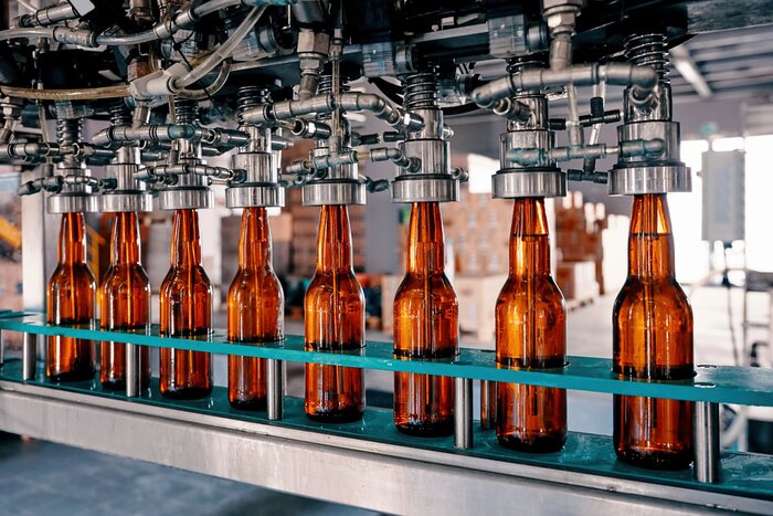 Poster Beer bottles filling on the conveyor belt in the brewery factory