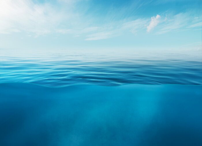 Poster Blue sea or ocean water surface and underwater with sunny and cloudy sky