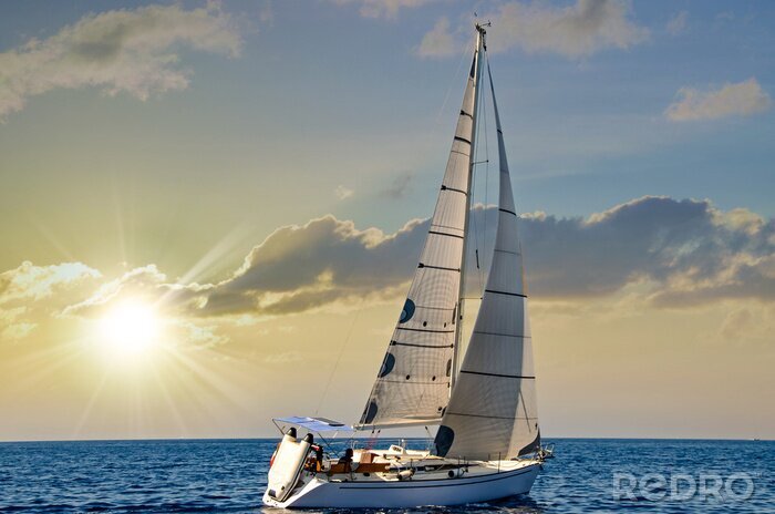 Poster Close-up sailboat sailing under a beautiful sunset