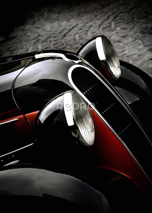 Poster Close-up van de koplampen van een zwarte retro auto
