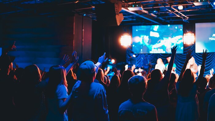 Poster crowd of people at worship concert