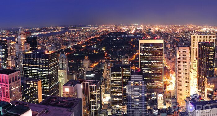 Poster De skyline van New York City 's nachts