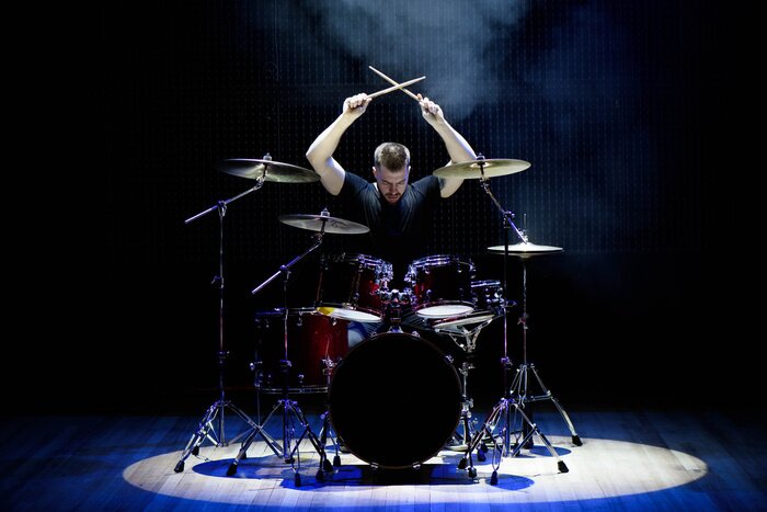 Poster Drummer playing the drums with smoke and powder in the background