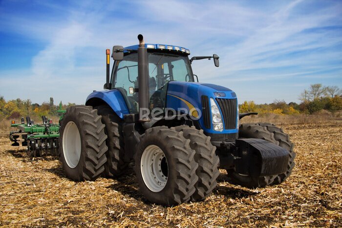 Poster Een moderne tractor in het veld