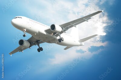 Poster Een vliegtuig in de blauwe lucht