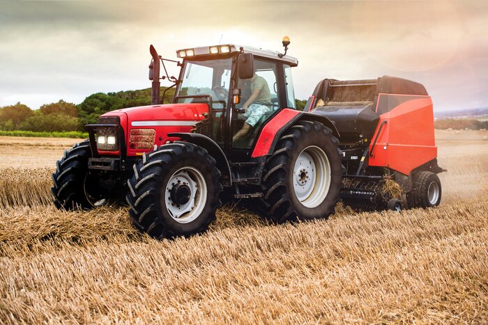 Poster Farmer in fields making straw bales