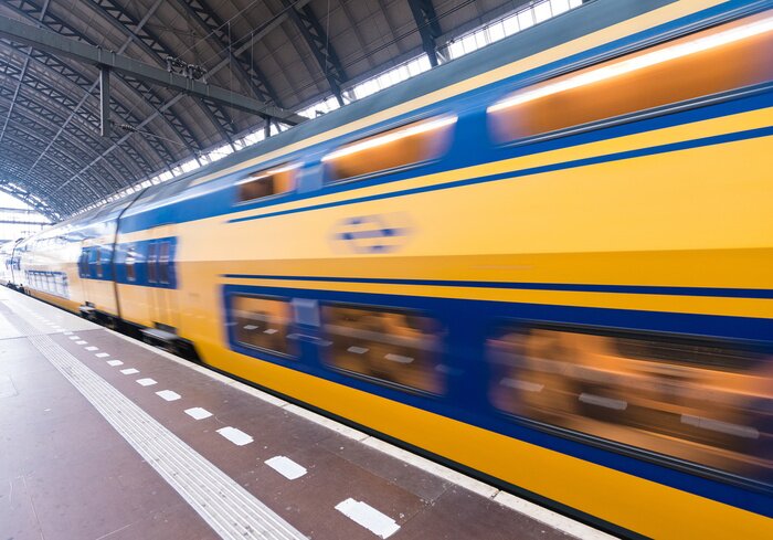 Poster Fast moving train in Amsterdam Central Station