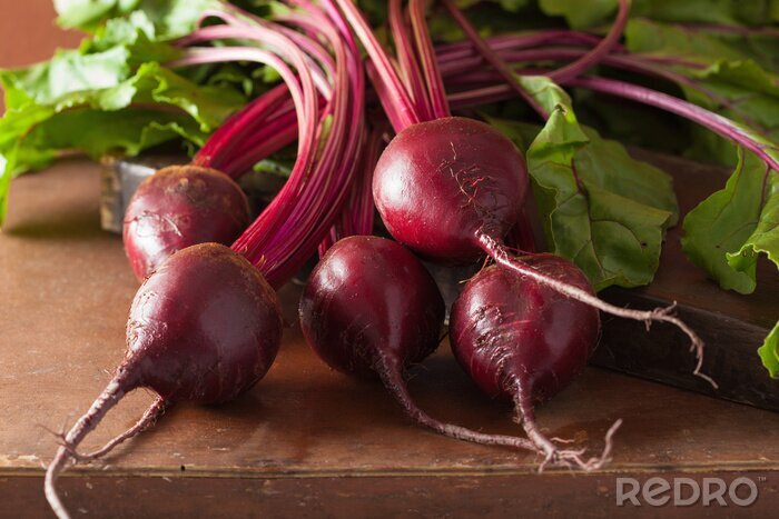 Poster fresh beetroot on wooden background