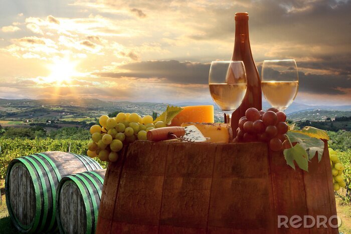 Poster Glazen en druiven op een vat