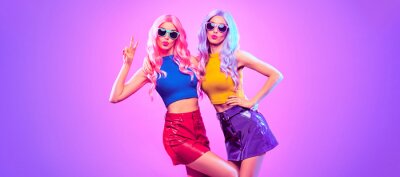 Poster Gorgeous Disco Party girl with Having Fun, neon style. Pink Purple hairstyle. High Fashion. Two young beautiful model woman friends Dance, colorful neon Light. Night Clubbing.Pop Art fashionable Style