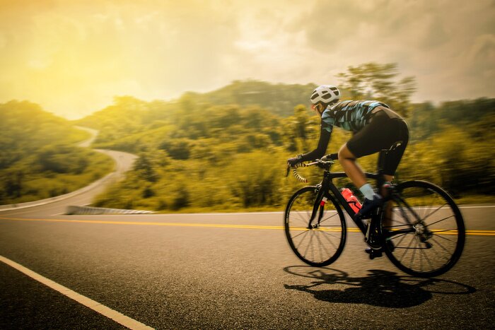 Poster Landschap en fietser in beweging