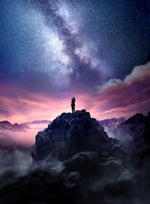 Poster Night sky long exposure landscape. A man standing on a high rock watching the stars rise into the night sky. Photo composite.