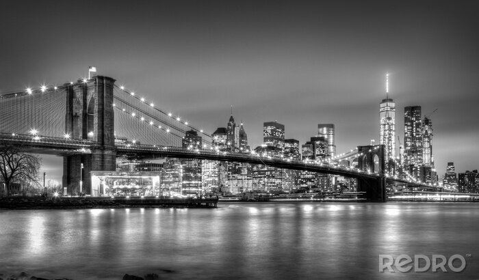 Poster Panorama van New York City met de Brooklyn Bridge bij nacht