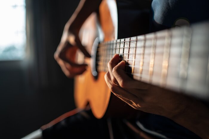 Poster Performing Classical Guitar. Focus on left hand