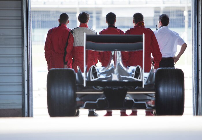Poster Race car sitting in garage