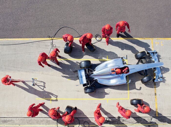 Poster Racing team working at pit stop