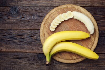 Poster Rijpe bananen en een gesneden