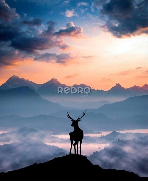Poster Silhouet van een hert op een bergtop bij zonsondergang