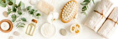 Spa concept with eucalyptus oil and eucalyptus leaf extract natural /organic spa cosmetics products, eco friendly bathroom accessories. Skincare concept on white background. Flat lay composition 