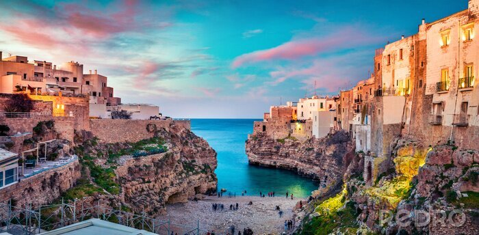 Poster Spectacular spring cityscape of Polignano a Mare town, Puglia region, Italy, Europe. Colorful evening seascape of Adriatic sea. Traveling concept background..